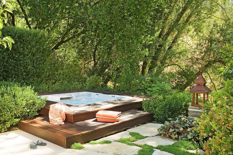 Well-spaced hot tub installation in a backyard